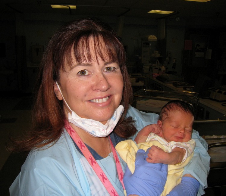 Janice Banther of Birth Behind Bars hold a newborn baby